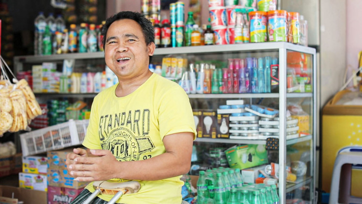 Cahyo Widodo, a disabled agent partner of GrabKios in Salatiga, is now financially independent.