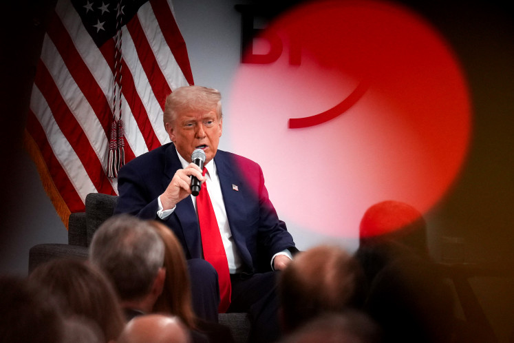 United States President Donald Trump delivers remarks at the Business Roundtable's quarterly meeting at the Business Roundtable headquarters on March 11, 2025, in Washington, DC. Trump addressed the group of CEO’s as his recent tariff implementations have sparked uncertainty that have helped fuel a market sell-off.